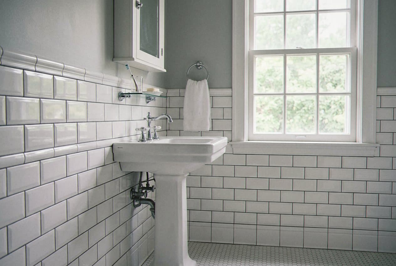 Classic white subway tile bathroom with pedestal sink